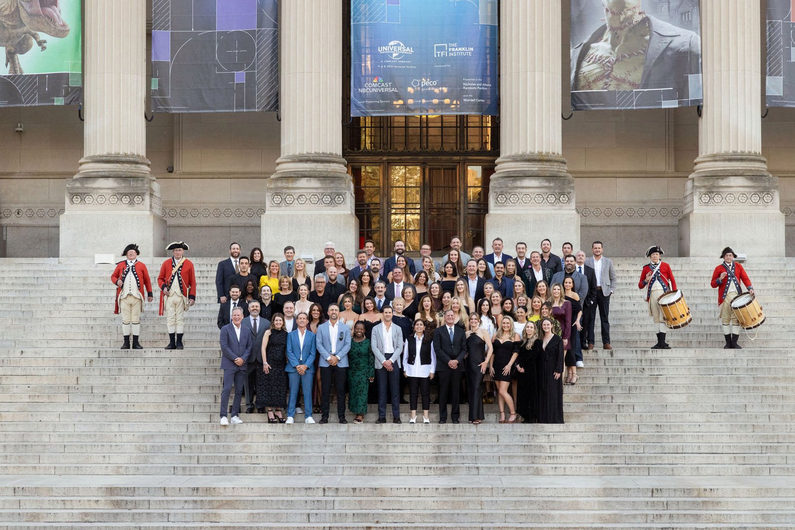 Large formal group photo of attendees on museum steps with a columned facade at the Tiger Gala 2026, by Marquee Visuals.